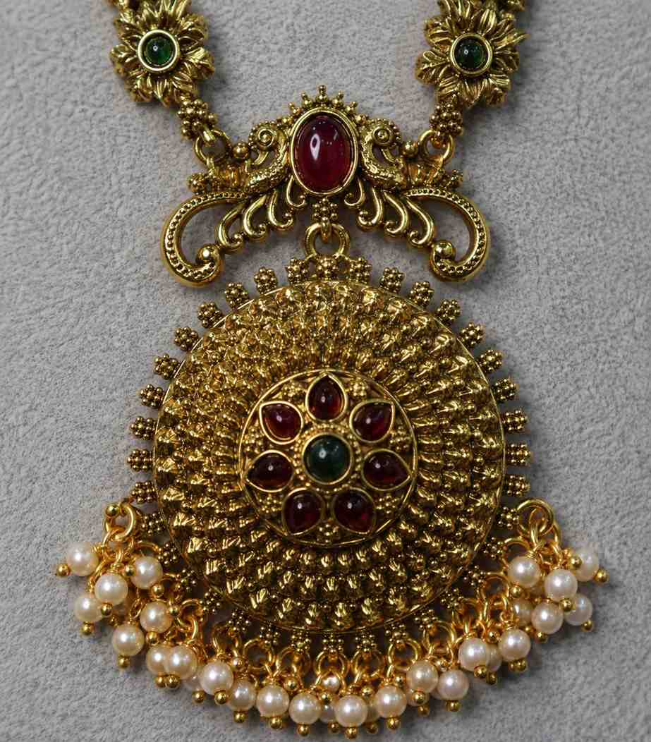 6628 Traditional Antique Gold Temple Jewellery Set with Long Haram Necklace, Jhumka Earrings, Ruby & Emerald Stones, and Pearl Drops